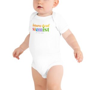Baby wearing white "future deaf stemist" onesie with logo