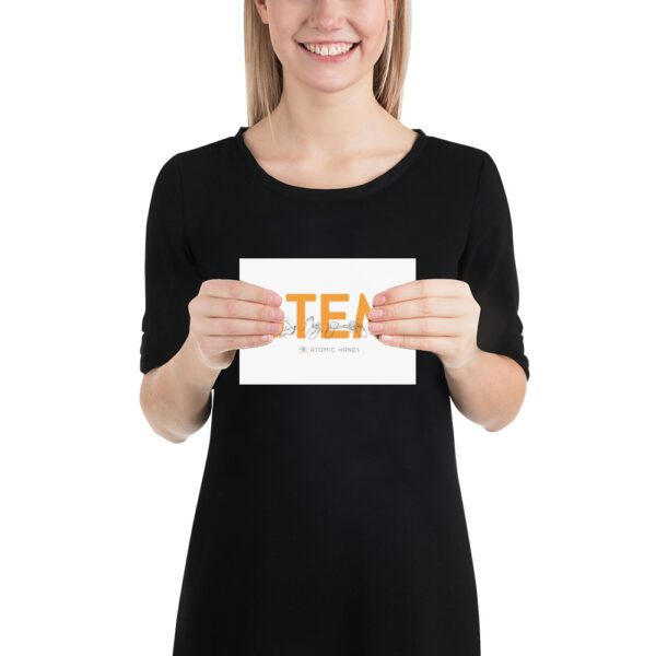 Female model holding a poster that shows "STEM" in orange with black illustrations.