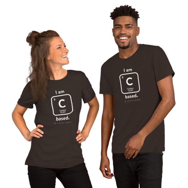 Female and male models wearing a brown "I am Carbon (as an element) Based" shirt. Atomic Hands logo on the bottom.
