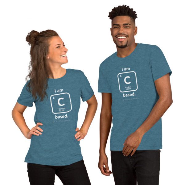 Female and male models wearing a teal "I am Carbon (as an element) Based" shirt. Atomic Hands logo on the bottom.
