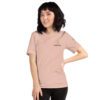 Female model wearing peach shirt with "technology" and an illustration of how to sign technology is on the upper left chest