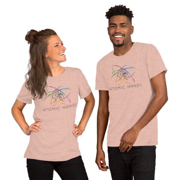 Female and male model wearing peach shirt with atomic hands logo fully across the chest