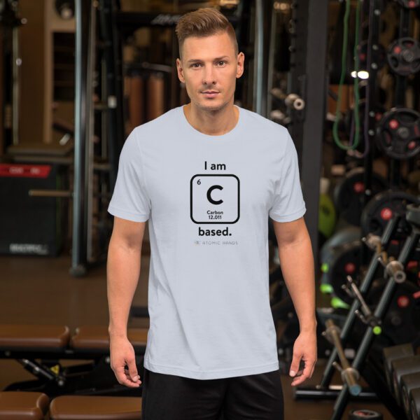 Male model in the gym wearing a light blue "I am Carbon (as an element) Based" shirt. Atomic Hands logo on the bottom.