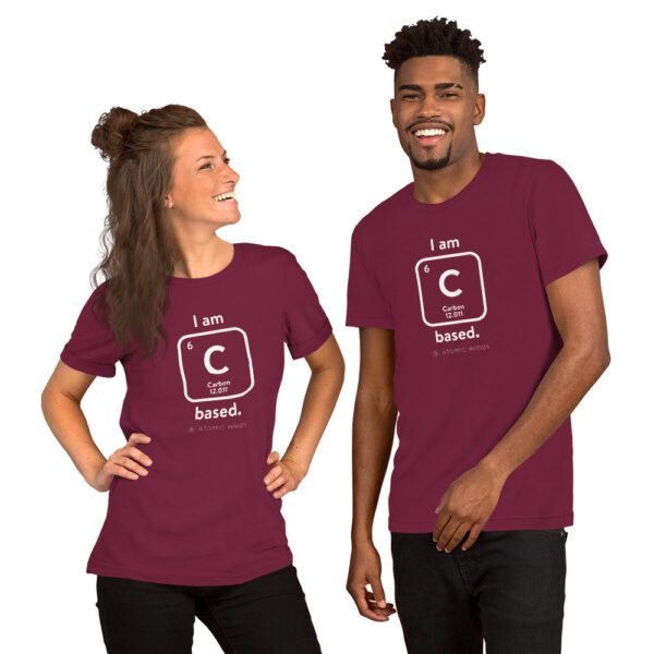 Female and male models wearing a maroon "I am Carbon (as an element) Based" shirt. Atomic Hands logo on the bottom.