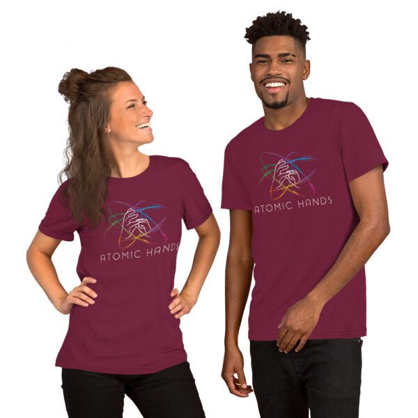 Female and male model wearing maroon shirt with atomic hands logo fully across the chest