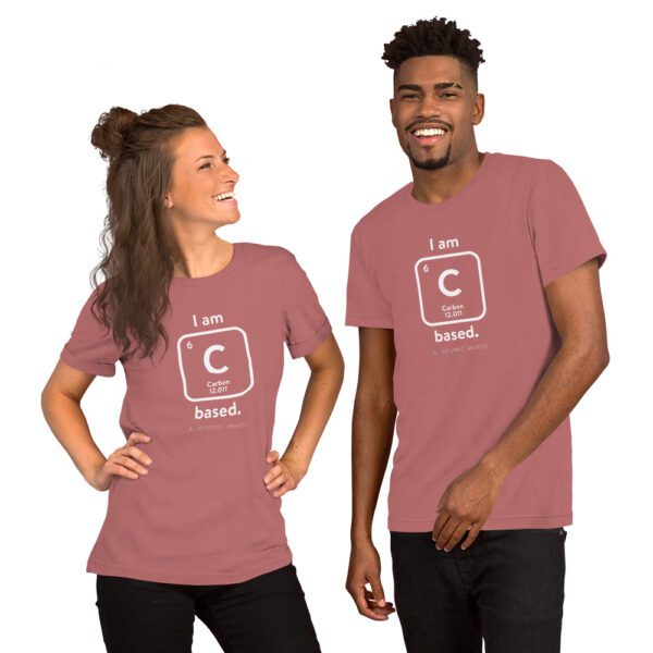 Female and male models wearing a mauve "I am Carbon (as an element) Based" shirt. Atomic Hands logo on the bottom.