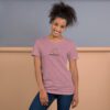 Female model wearing orchid shirt with "mathematics" and an illustration of how to sign mathematics is on the chest