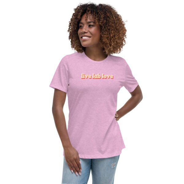 Female model wearing lilac shirt with "live lab love" in funky retro font/colors